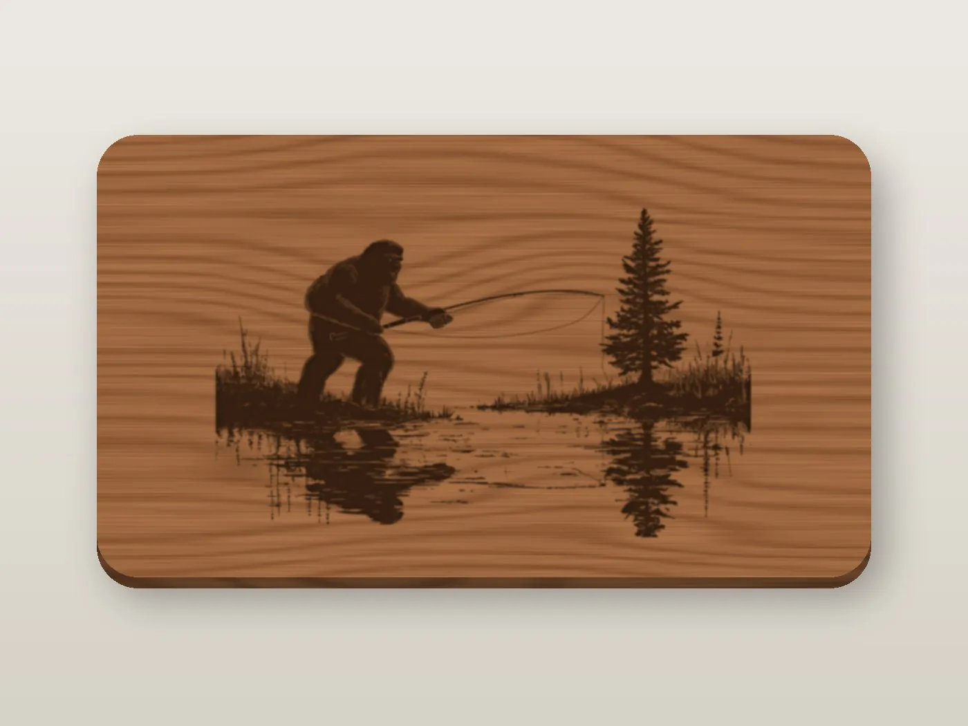 A walnut sign engraved with Bigfoot fly fishing on a still lake